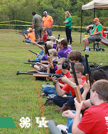 4-H youth laying prone shooting air rifles at 4-H Shooting Sports State Competition
